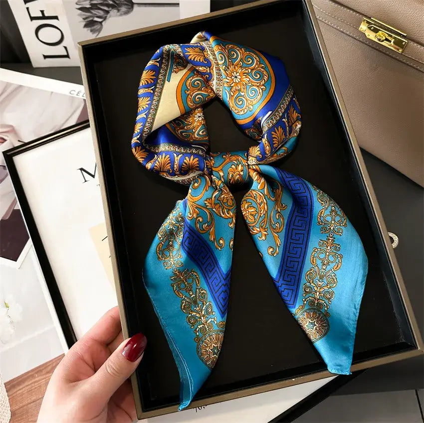 Elegant Foulard di Seta "Bandana Miami" in blue and gold, 70x70 cm, displayed in a gift box.